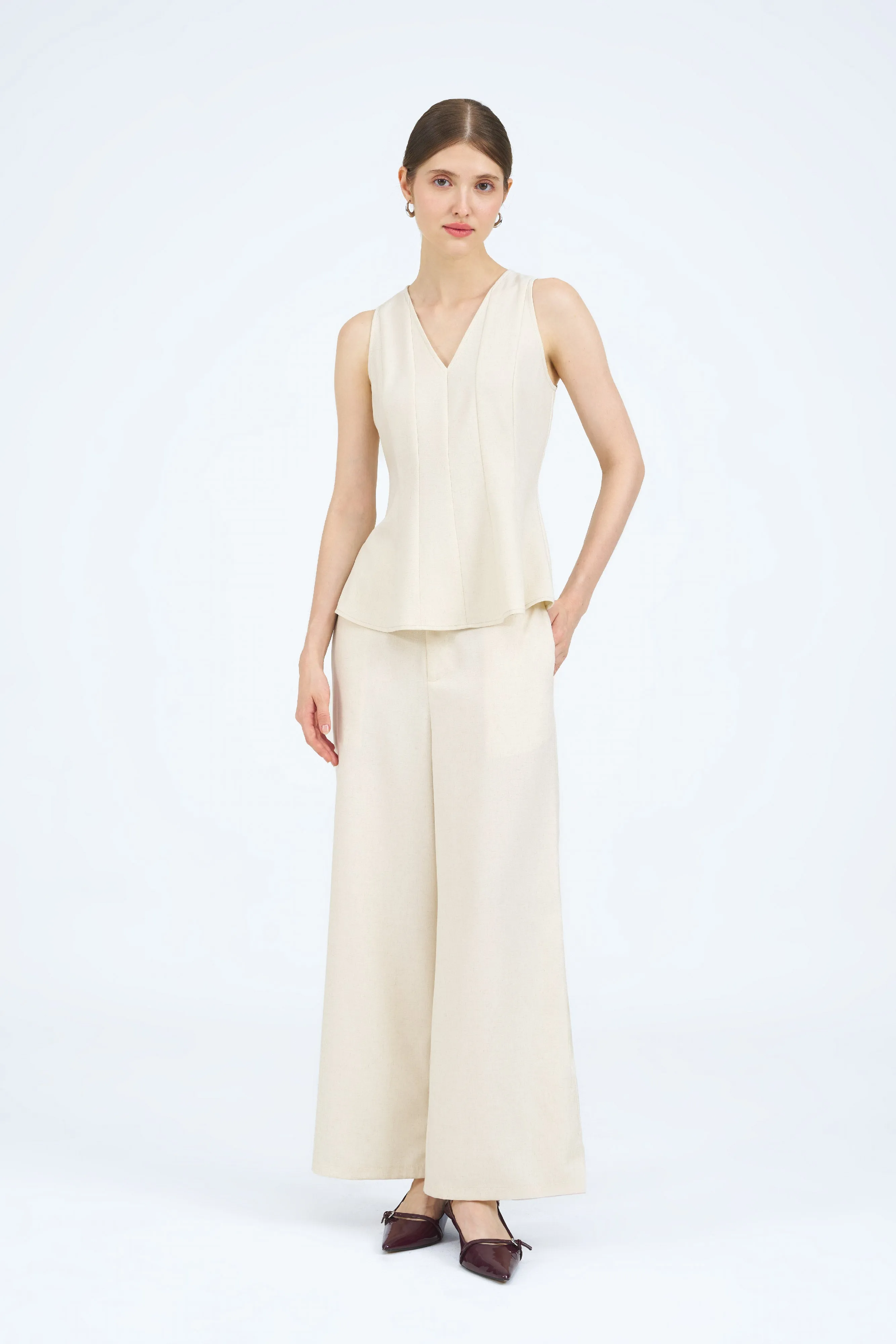 [Backorder] Danika Sleeveless Peplum Panel Top in Ivory Beige