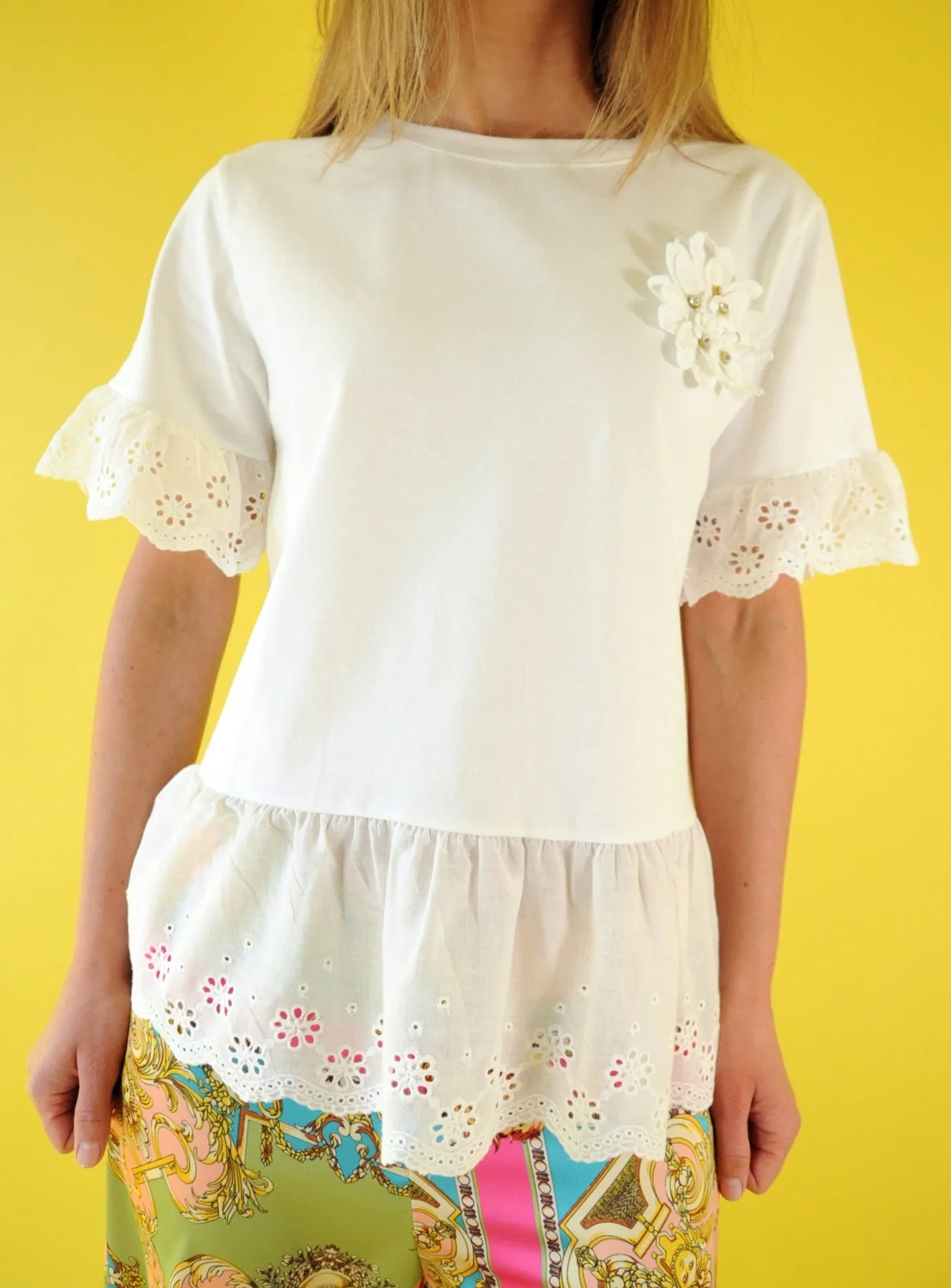 Off white broderie anglaise frilled peplum tee with 3D gem flower detail