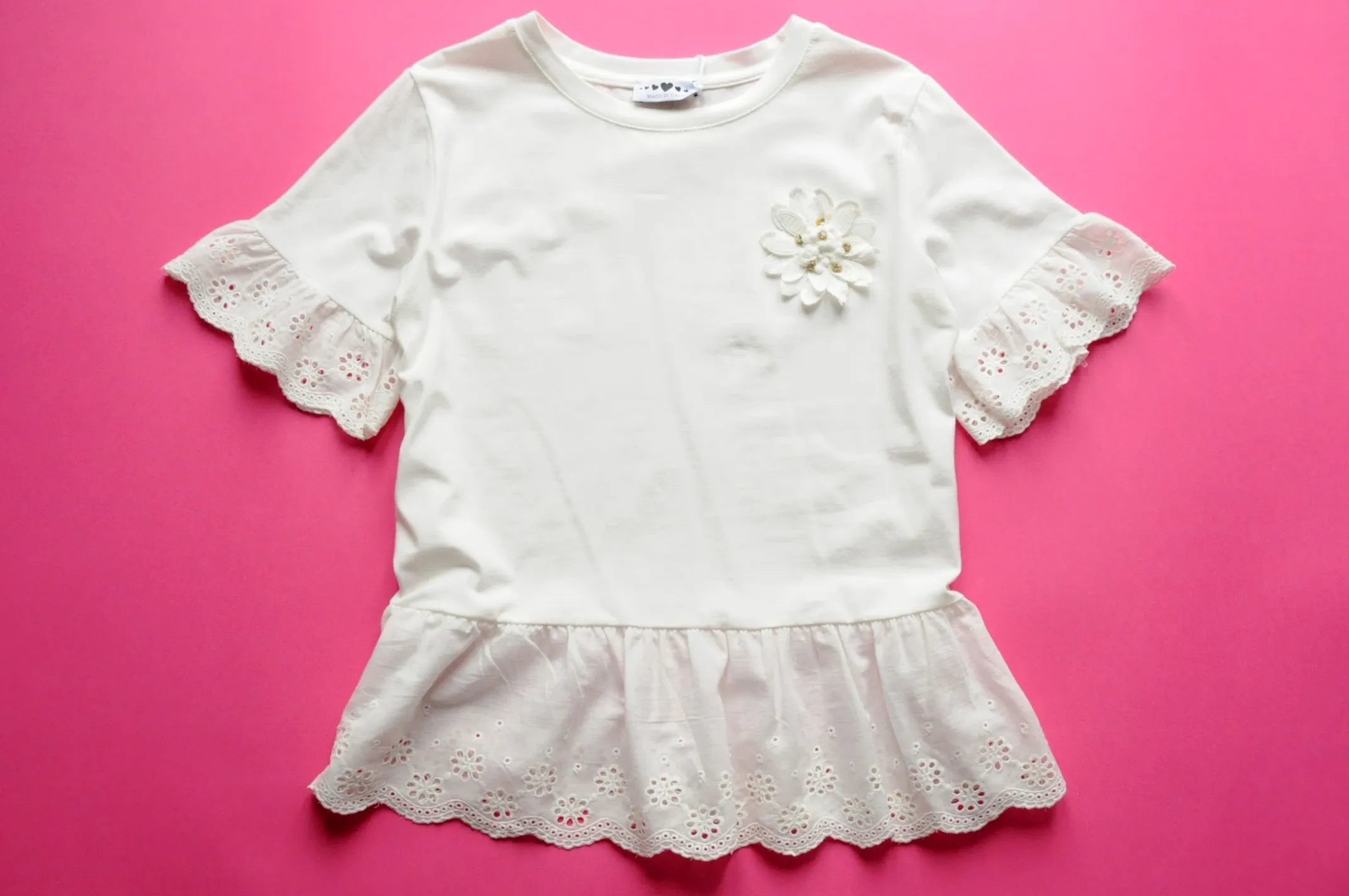 Off white broderie anglaise frilled peplum tee with 3D gem flower detail